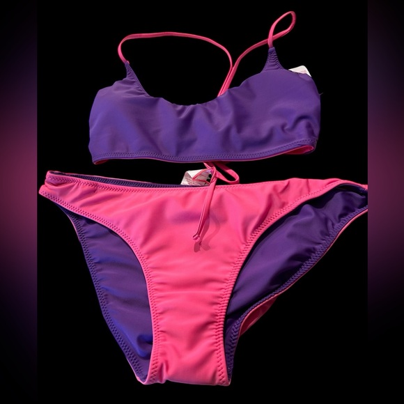 A No Boundries bikini that is reversible and can be pink or purple or a combo - Picture 8 of 10